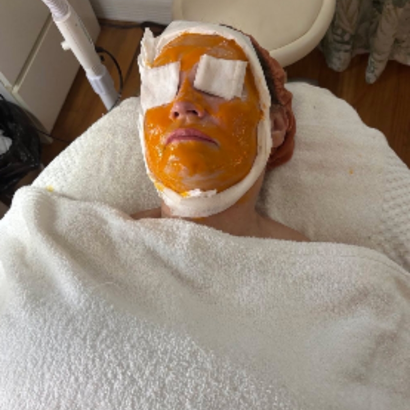 A hand-blended treatment mask being applied